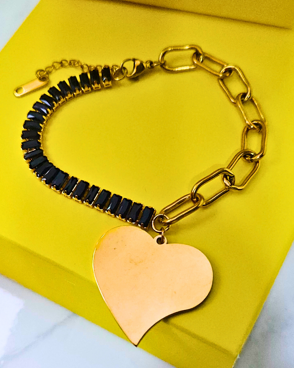 Bracelet with baguette zircons and heart pendant