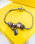 Movable charm bracelet