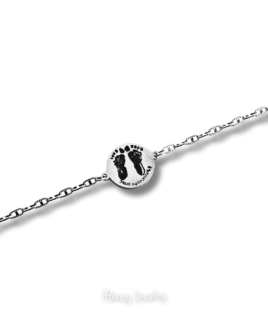 PULSERA PLACA REDONDA CON HUELLAS DE BEEB